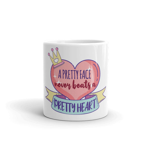 5_133 - A pretty face never beats a pretty heart - White glossy mug